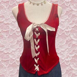 Red velvet corset top with white ribbon and lace